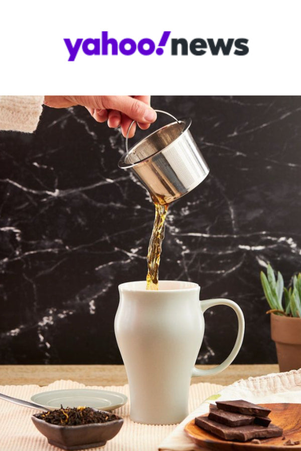 yahoo! news a hand removes an infuser from a tea mug
