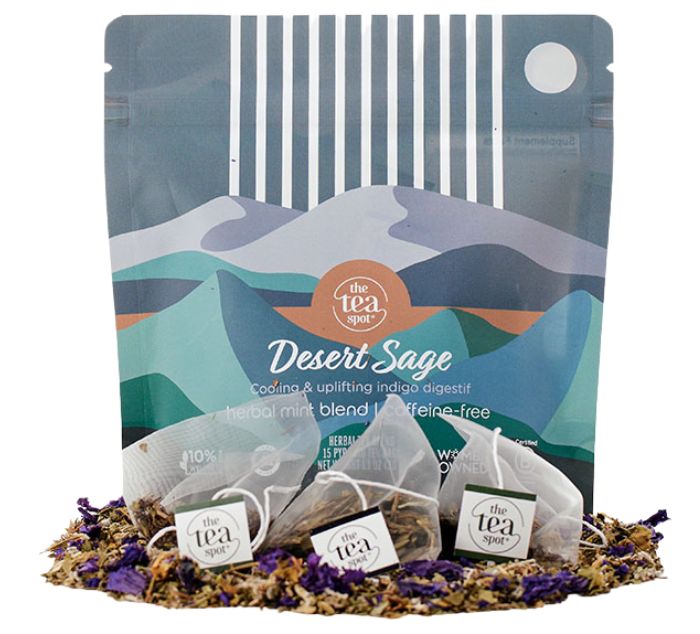 desert sage tea bags sit on loose leaf tea in front of a bag that reads desert sage herbal blend