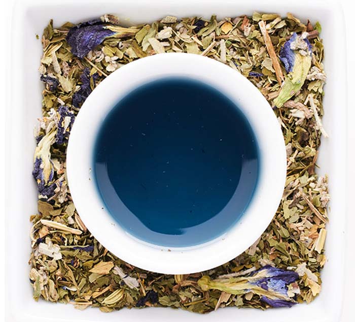 desert sage loose leaf tea surrounds a brewed cup of tea