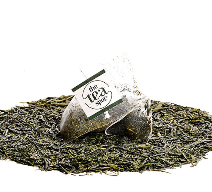 
                  
                    a tea bag sits on loose leaf tea
                  
                