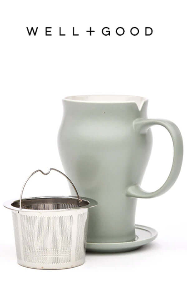green tea mug with stainless steel infuser in foreground