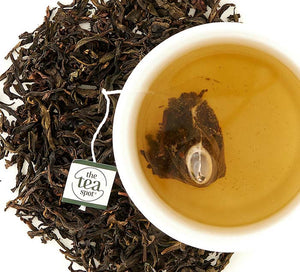 award-winning dancong oolong tea loose leaf tea and teabag steeped in a tea cup