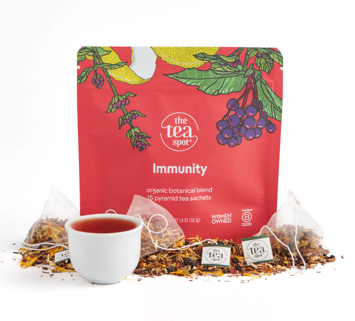 a bag reading Immunity organic botanical blend with loose leaf tea and tea bags in front of it