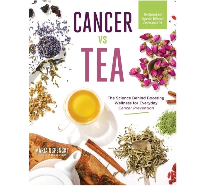 Book cover for 'Cancer vs Tea' by Maria Uspenski, featuring a white background with scattered herbal ingredients, a cup of yellow tea, cinnamon sticks, and a green label at the top right.