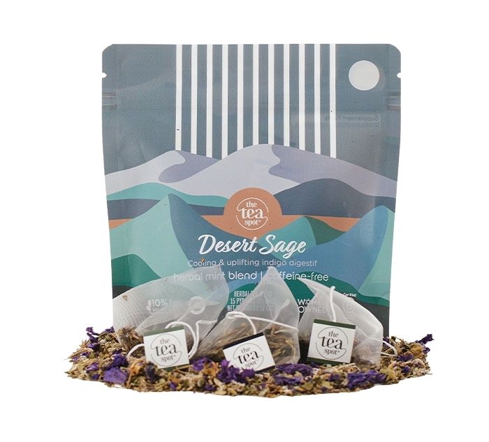 desert sage tea bags sit on loose leaf tea in front of a bag that reads desert sage herbal blend