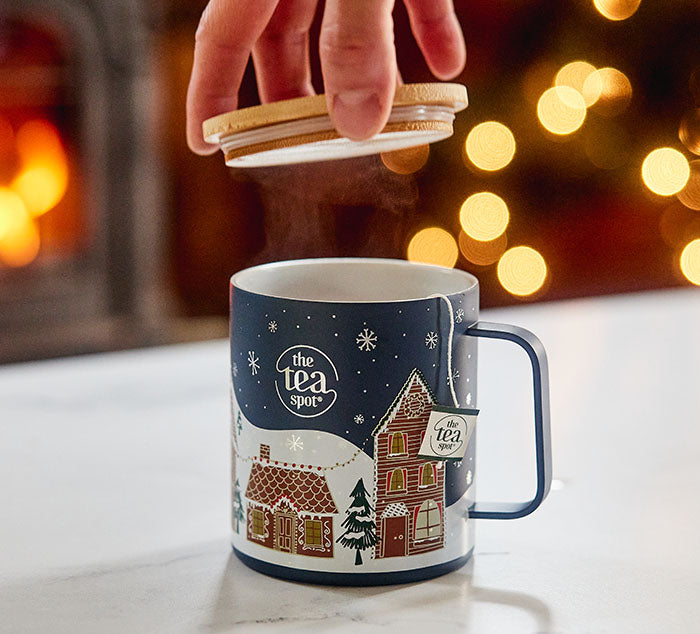 
                  
                    a metal camping mug with bamboo lid has a holiday painting on the outside
                  
                