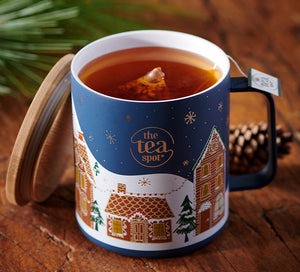 a metal camping mug with bamboo lid has a holiday painting on the outside