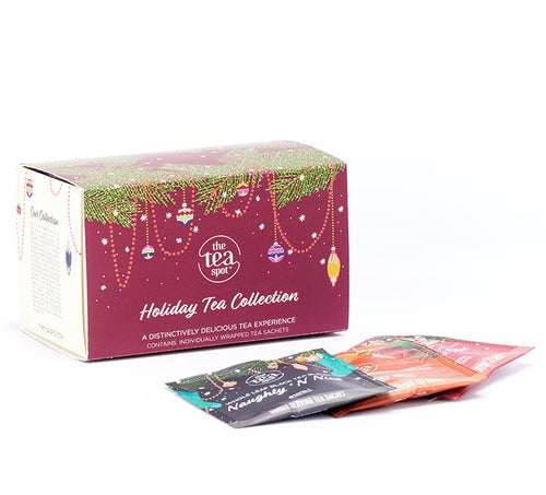 a box reading holiday tea collection sits behind three holiday tea bags 