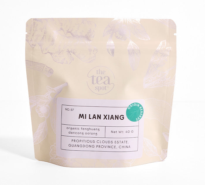 Tea package labeled 'Mi Lan Xiang' from 'The Tea Spot' on a white background
