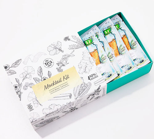 a box reading mocktail kit cold brew sampler is open with six pouches of loose leaf tea in it