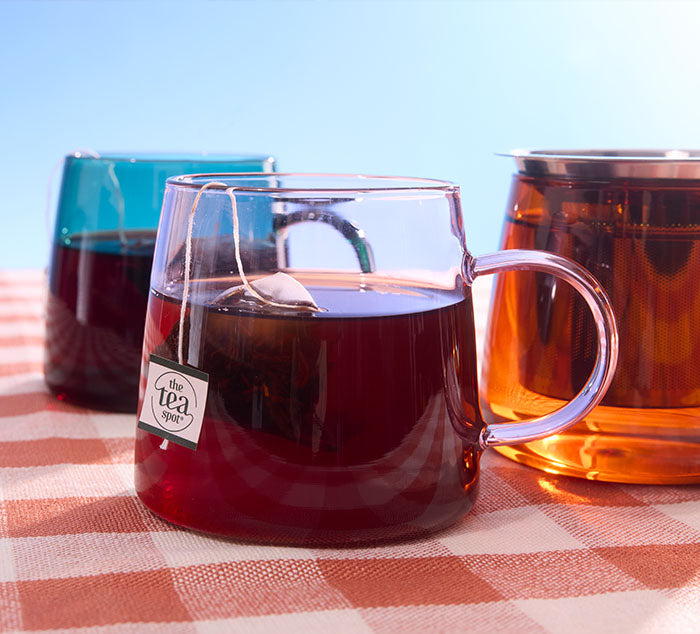 
                  
                    colored tea mugs steeping tea
                  
                