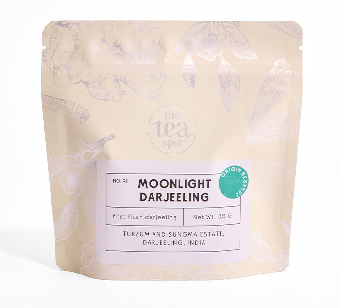 
                  
                    Tea package labeled 'Moonlight Darjeeling' from 'The Tea Spot' on a white background
                  
                