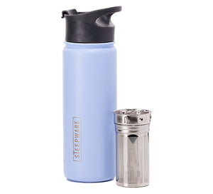 a mountain tea tumbler with an infuser sitting next to it