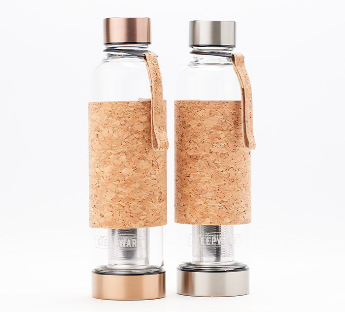 two glass tea tumblers with bamboo sleeves and a built in tea infuser