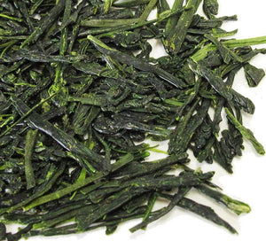 88th Night Japanese Green Tea Loose Leaf Tea leaves sit on a white surface