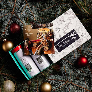 Good tidings loose leaf tea gift set sits on a christmas tree with ornaments