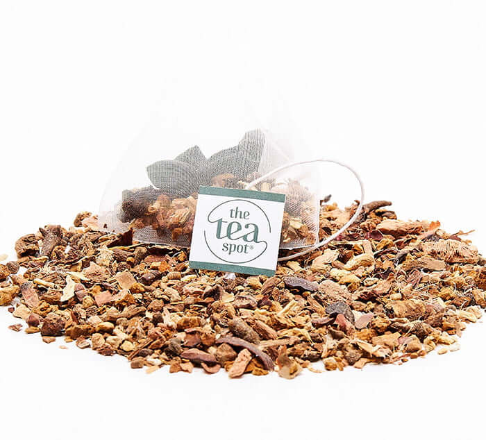 
                  
                    adaptogen reset tea bag sits atop adaptogen reset loose leaf tea
                  
                