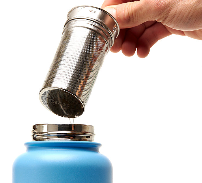 
                  
                    a person lifts an infuser out of a tea tumbler
                  
                