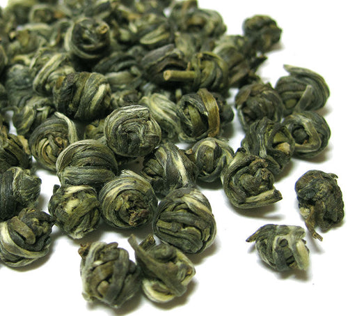 Jasmine Pearl Green Tea Loose Leaf green tea pearls in a pile